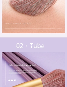 Detail of makeup brush with purple frosted handle and gold thickened aluminum tube