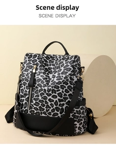 Detailed view of leopard print backpack with PU texture and front metal zipper pocket