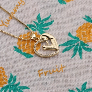 Collier cœur doré avec pendentif mère et enfant et pierres de zircone scintillantes