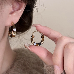 Gold-plated geometric round hoop earrings with brown tiger eye beads for a modern retro look