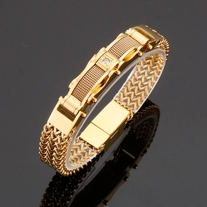 Macro detail of men's 18K gold stainless steel link bracelet with inlaid zircon stone