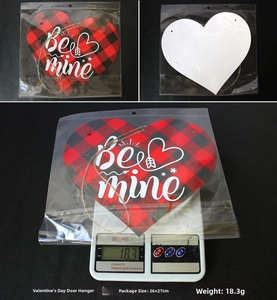 Detail of red buffalo plaid heart sign with Be Mine text and hanging twine rope