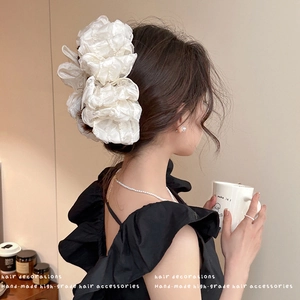 Large white tiered bow hair claw clip for women made of elegant pleated tulle fabric