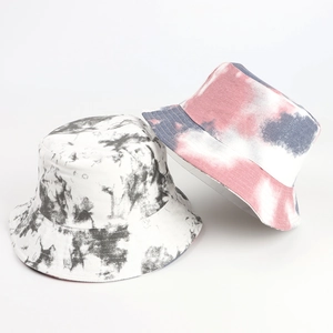 Detail view of colorful tie-dye bucket hats with thick canvas texture and neat stitching