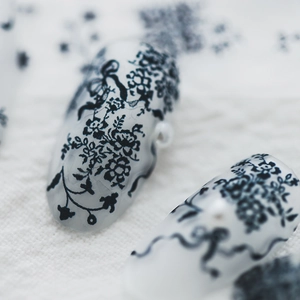 Semi-transparent matte nail stickers with black lace floral patterns and pearl detail