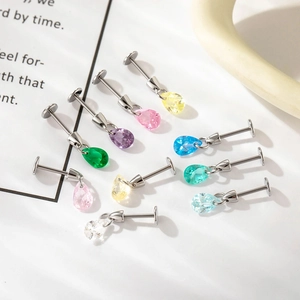 Set of eight colorful teardrop zircon cartilage studs in vibrant dopamine hues