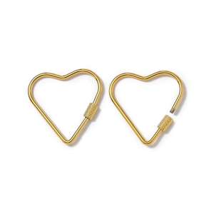 Macro detail of gold heart-shaped metal carabiner connector with screw lock mechanism