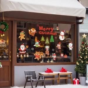 Festive Christmas window stickers featuring Santa, reindeer, and tree for shop decoration