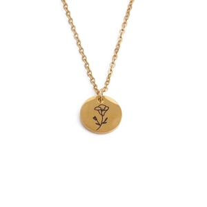 Close-up of golden stainless steel necklace with engraved floral pattern pendant