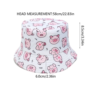 Size chart of white bucket hat with pink pig patterns showing dimensions in cm and inches