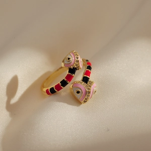 Macro shot of 18K gold plated snake ring featuring pink heart-shaped heads and crystals