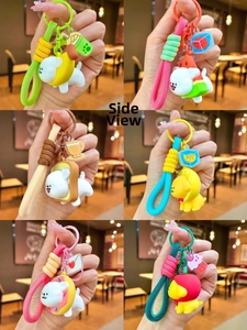 Side view of cute puppy fruit keychains with silicone charms and woven lanyards