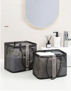 Detail of black mesh bath storage baskets with handles and Bath Storage text