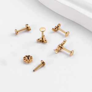 G23 titanium golden cartilage studs set featuring leaf and flower zircon designs