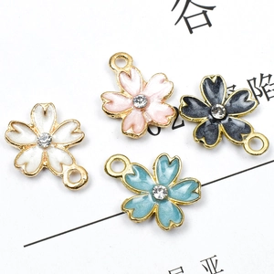 DIY cherry blossom charms with colorful enamel finish and crystal center for jewelry making