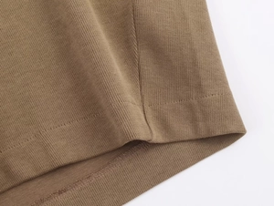 Detailed close-up showing double-stitched hem and fine knit texture of the brown lounge set