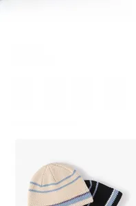 Detailed close-up showing thick knit fabric texture of beige and black striped beanies