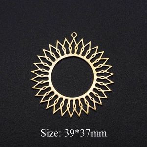 Polished gold stainless steel hollow sun circle pendant measuring 39x37mm on black background