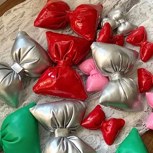Glossy metallic Christmas bows in red silver pink and green for gift wrapping