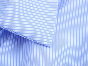 Detailed view of collar stitching and texture on blue striped button-down shirt