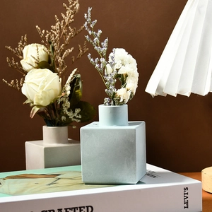 Modern square silicone mold for cube flower vase with matte texture and decorative dry flowers