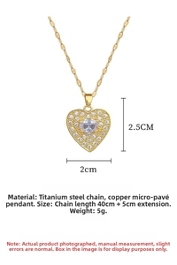 Macro detail of heart pendant showing dimensions 2x2.5cm and shiny pave rhinestones
