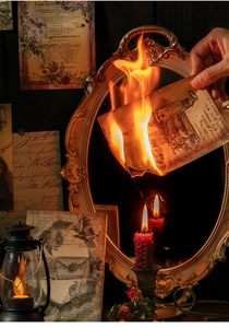 Artistic macro shot of burning vintage scrapbook paper with dark academia aesthetic
