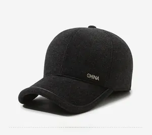 Detail view of winter wool blend cap for men featuring a metal CHINA logo and ear protection