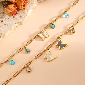 Close-up of 18k gold plated butterfly bracelet with crystal and turquoise beads