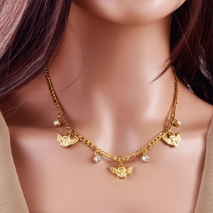 Golden angel necklace with sparkling zircon pendants on a model for a chic look