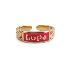 Detailed macro view of the 18k gold plated Hope letter ring with red enamel inlay