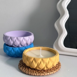 Macro shot of geometric relief textured candle jars with 3D diamond cut pattern finish