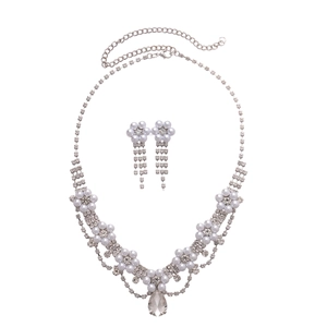 Elegant silver necklace and floral tassel earrings set with crystals and pearls