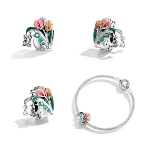 S925 sterling silver bird and tulip enamel charm on a classic snake chain bracelet