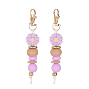 Handmade daisy beaded keychain with silicone flowers and wooden beads on gold clasp