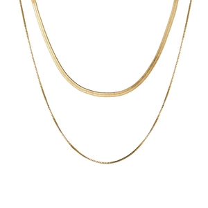 Layered gold snake bone and box chain necklace for a minimalist jewelry look