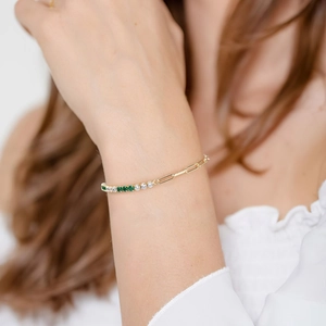 Elegant gold S925 silver bracelet featuring green rectangular gems and paperclip chain links