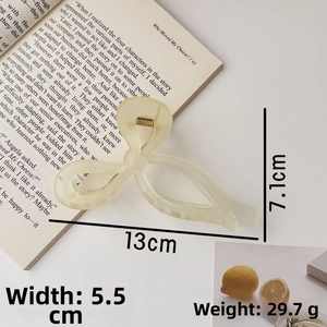 Creamy translucent frosted acrylic bow hair claw clip showing 13cm length dimensions