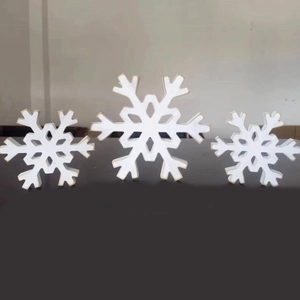 Three-piece set of white wooden snowflake ornaments for Christmas tabletop decor