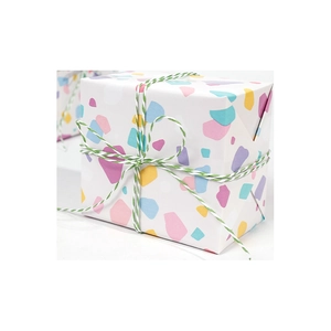 Colorful confetti pattern gift wrapping paper roll with green and white cotton twine