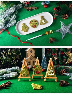 Detailed view of Christmas tree and wreath cookies with icing on festive holiday trays