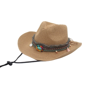 Detail of western straw cowboy hat with ethnic beaded band and turquoise turquoise accent