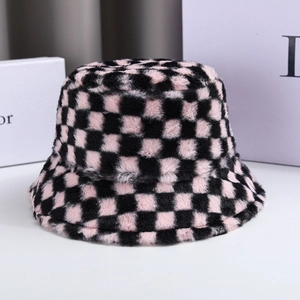 Close-up of pink and black checkered faux fur bucket hat with thick plush texture