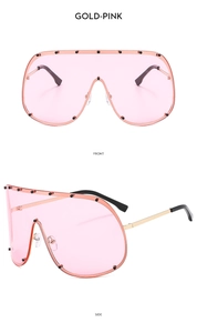Front and side views of gold frame pink lens oversized shield sunglasses with rivets