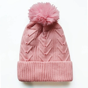 Pink winter knit beanie for women with large pom-pom and elegant pearl embellishments