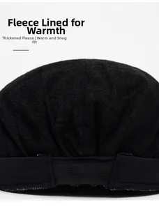 Detail of warm black plush lining and adjustable elastic strap on winter newsboy cap