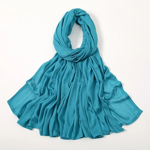 Detailed view of breathable peacock blue modal scarf with soft texture and elegant pleats