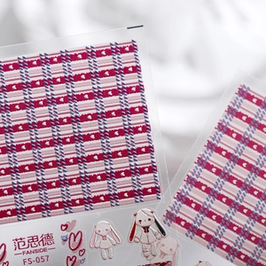 Embossed 3D nail art stickers with red plaid pattern and cute rabbit designs
