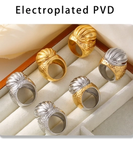 Close-up of vintage textured PVD 18k gold plated stainless steel rings in a gift box