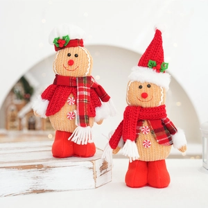 Pair of festive gingerbread man plush dolls with red hats for Christmas home decor